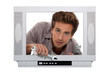 Photo: Concept shot of a young man trying to fix a television Concept shot of a young man trying to fix a television
