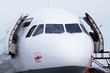 Photo: Nose and cockpit of airplane at airport close up Nose and cockpit of airplane at airport close up