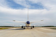Photo: Back view of airplane standing on runway at aerodrome Back view of airplane standing on runway at aerodrome
