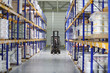 Man works on loader machine at factory