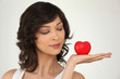 Photo: young woman holding a plastic hearth in her hand young woman holding a plastic hearth in her hand