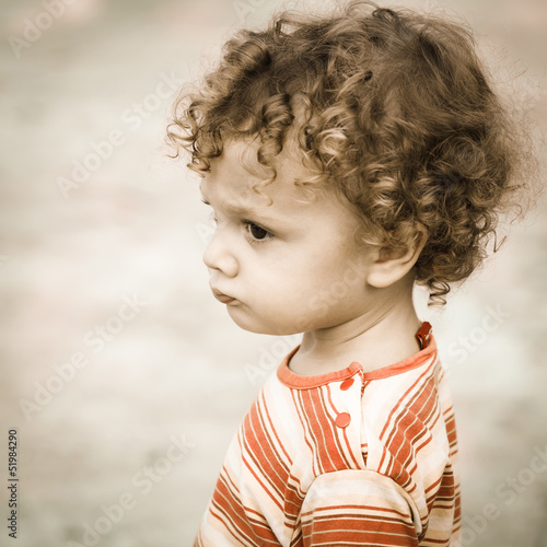 Photo: Portrait of sad child Portrait of sad child