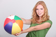 Foto: young woman with a beach ball young woman with a beach ball
