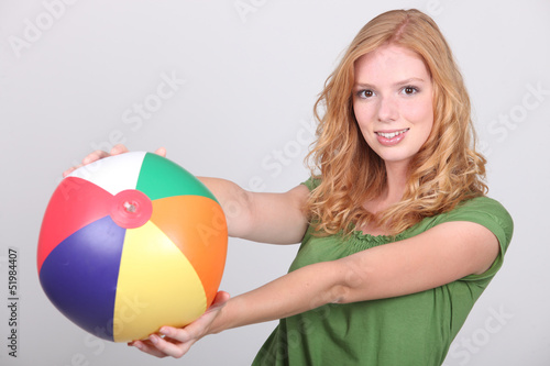 Photo: young woman with a beach ball young woman with a beach ball