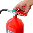 Holding fire extinguisher isolated over white background