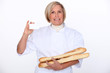 woman holding bread and showing her personnal card