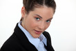 young woman in a suit posing