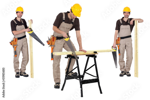 Photo: Carpenter using handsaw Carpenter using handsaw