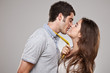 young loving kissing couple on isolated background  