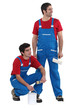 craftsman painter and apprentice working together