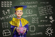 Photo: Happy scholar dressed toddler with piggybank Happy scholar dressed toddler with piggybank