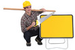 carpenter holding plank over shoulder and handsaw