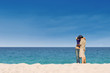 Romantic couple kissing at paradise beach