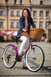 Urban biking - middle-age woman and bike in city