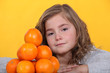 Photo: little stood with pile of oranges little stood with pile of oranges