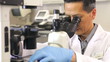 Video: Male Scientist Using Microscope In Laboratory Male Scientist Using Microscope In Laboratory