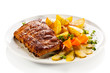 Photo: Tasty grilled ribs with vegetables Tasty grilled ribs with vegetables