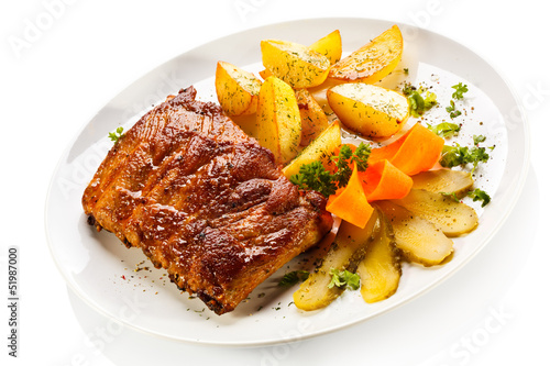 Photo: Tasty grilled ribs with vegetables Tasty grilled ribs with vegetables