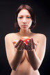 Photo: Nude woman offers apple Nude woman offers apple