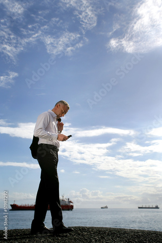 Photo: businessman sending a message businessman sending a message