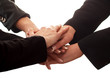 business people putting their hands on top of each other