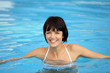 Cheerful woman in swimming pool