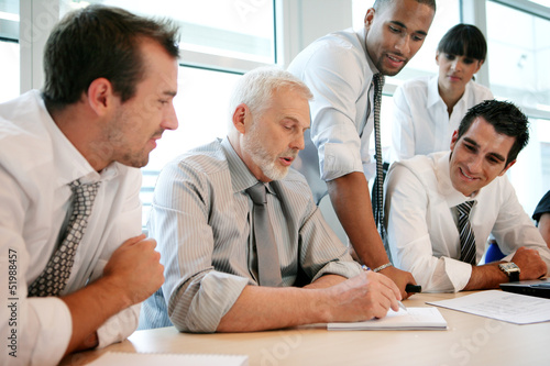 Photo: Sales team having a meeting Sales team having a meeting