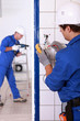 Photo: Electrician testing a light switch with a multimeter Electrician testing a light switch with a multimeter
