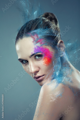 Photo: girl with coloured flying powder on face girl with coloured flying powder on face