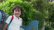 Portrait of a happy little boy at the park