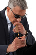 Photo: businessman wearing sunglasses businessman wearing sunglasses