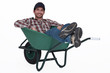 Foto: Man with a wheelbarrow. Man with a wheelbarrow.
