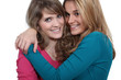Foto: Two female friends hugging. Two female friends hugging.