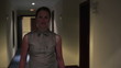 Young happy businesswoman walking in hall, steadicam shot