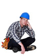 Photo: Bored builder sat on the floor Bored builder sat on the floor