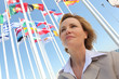 Photo: Businesswoman with flags. Businesswoman with flags.