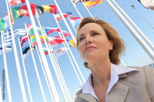 Photo: Businesswoman with flags. Businesswoman with flags.