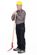 Photo: senior craftsman holding a shovel senior craftsman holding a shovel