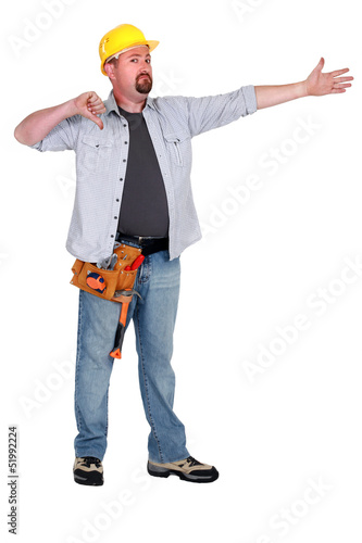 Photo: Thumbs down from a builder in empty copyspace Thumbs down from a builder in empty copyspace