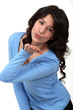 woman sending a kiss