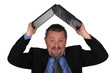 Man lifting computer over his head