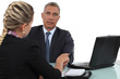 Two office workers in meeting