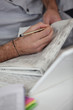 Man reading classified ads
