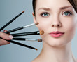 beautiful woman. Makeup brushes.