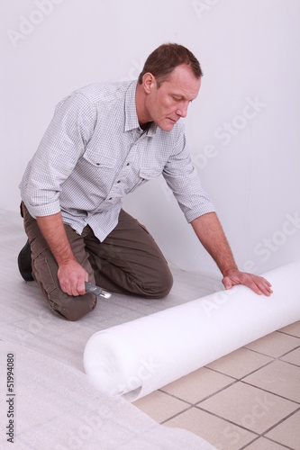 Photo: Laborer changing tiles Laborer changing tiles