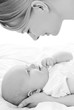 Foto: happy mother with baby over white happy mother with baby over white