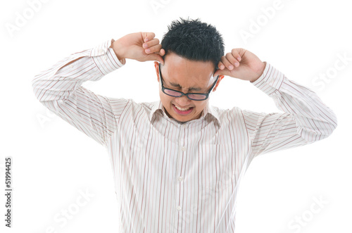 Photo: Asian business man holding his head. Conceptual image. Asian business man holding his head. Conceptual image.