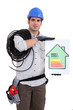 Tradesman holding an energy efficiency rating chart