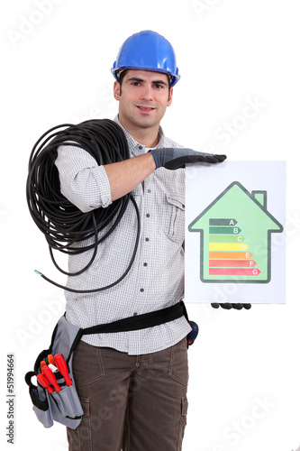 Photo: Tradesman holding an energy efficiency rating chart Tradesman holding an energy efficiency rating chart
