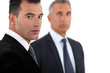 Photo: Serious businessman and an older colleague Serious businessman and an older colleague